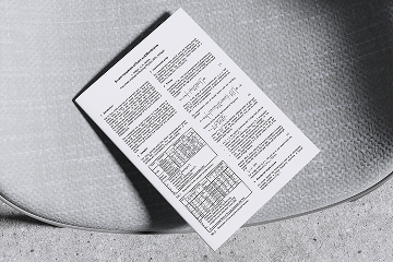 whitepaper on a chair with calculations on them